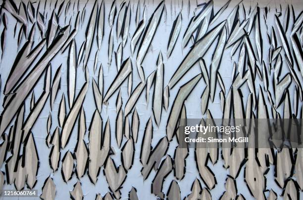 Sundamaged Pale Blue Plastic Film Peeling Off Stainless Steel High-Res Stock Photo