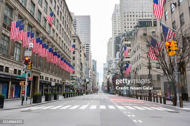 Fifth Avenue is empty of traffic as people remain at home to stop the spread of the Coronavirus pandemic on March 31, 2020 in New York City....