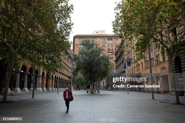 Man walks through Martin Place on April 01, 2020 in Sydney, Australia. The state of New South Wales in Australia has the highest number of reported...