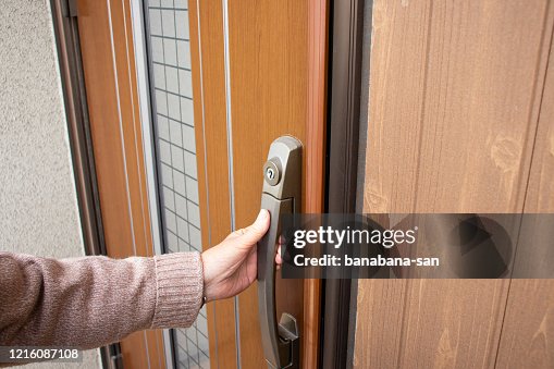 Elderly woman having a front door. Elderly woman having a front door.