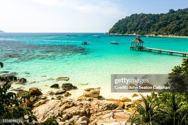 malaysia, beach and pier in the perhentian islands - perhentian island foto e immagini stock