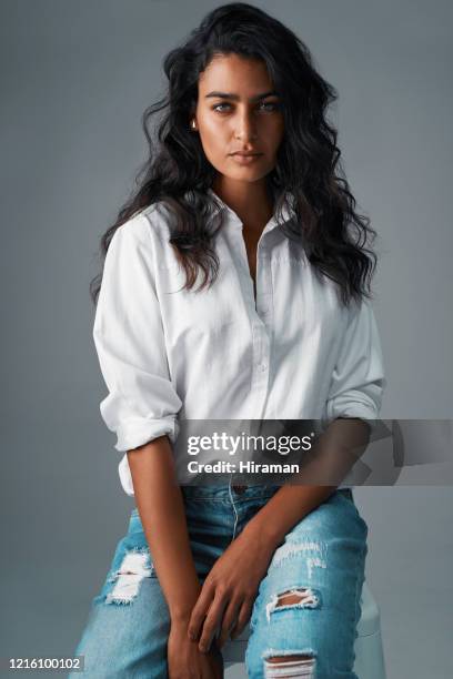 denim and a white blouse, always a classic - woman's blouse stock pictures, royalty-free photos & images