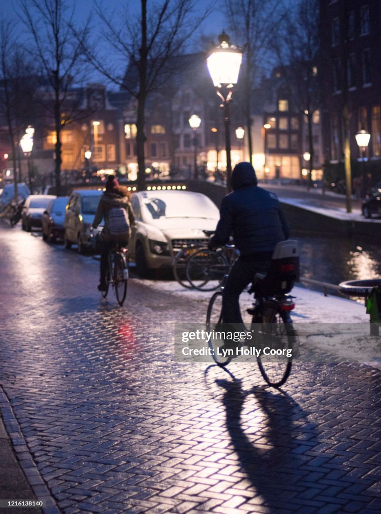 Cyclists in Amsterdam at night