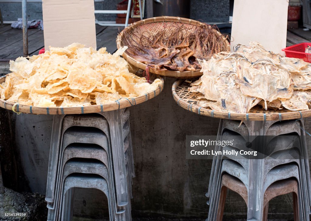 Dried fish for sale in baskets