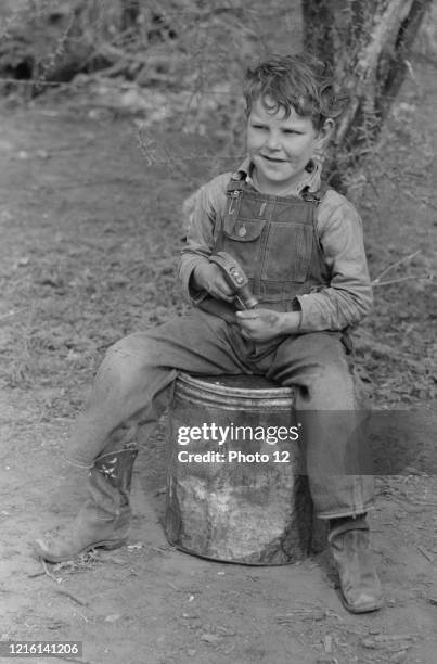 Child of white migrant worker near Harlingen, Texas by Russell Lee, 1903-1986, dated 1939.