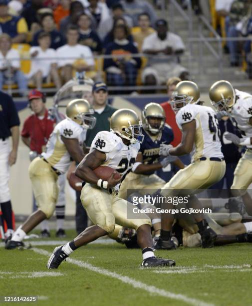 Running back Julius Jones of the Notre Dame Fighting Irish runs with the football against the University of Pittsburgh Panthers during a college...