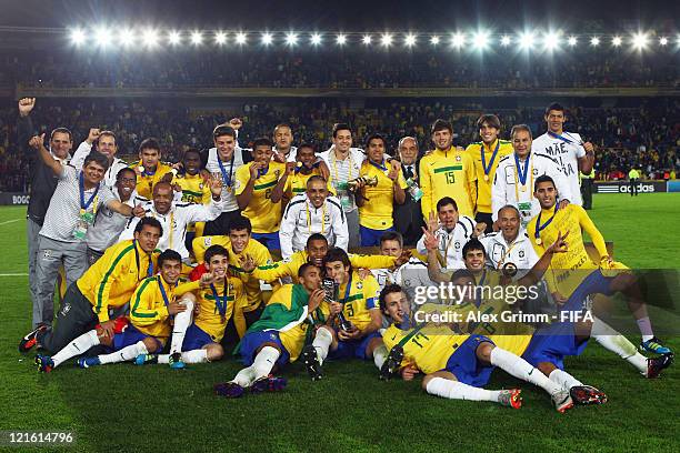 Players of Brazil celebrate with the trophy after winning FIFA U-20 World Cup 2011 final against Portugal at Estadio Nemesio Camacho 'El Campin' on...