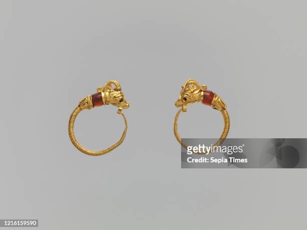 Ibex-head earrings, Ptolemaic Period, 2nd-1st century B.C., From Egypt, Gold; carnelian, a. As Worn: H. 1.8 _ W. 2.1 cm , Hoops formed of wound wire...