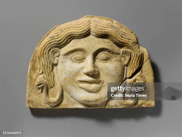 Terracotta gorgoneion antefix , Classical, 2nd half of the 5th century B.C., Greek, South Italian, Tarentine, Terracotta, H. 7 5/8 in. , Terracottas,...