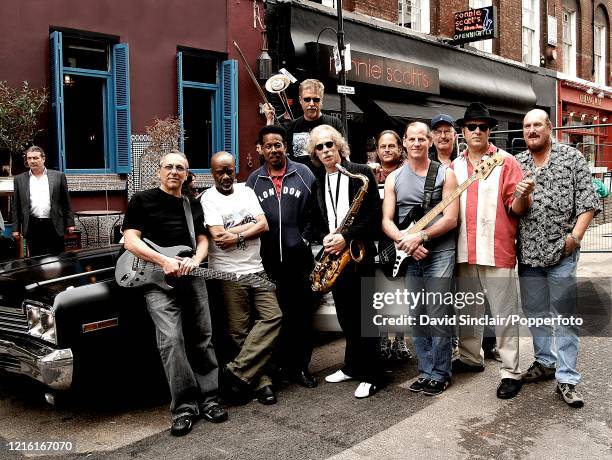 The Blues Brothers Band, featuring guitarist Steve Cropper and saxophone player Lou Marini, posed together outside Ronnie Scott's Jazz Club in Soho,...