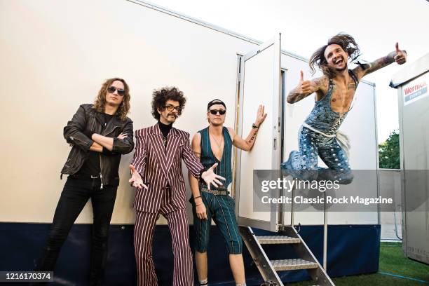 Dan Hawkins, Frankie Poullain, Rufus Taylor and Justin Hawkins of British rock group The Darkness, photographed at Chantry Park in Ipswich on August...
