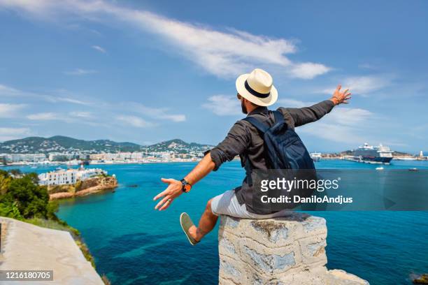 young guy enjoying traveling - spain beach stock pictures, royalty-free photos & images
