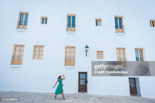 young brazilian woman exploring ibiza streets - ibiza town stock pictures, royalty-free photos & images