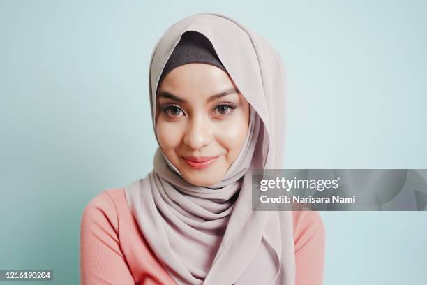 portrait of asian cute smile muslim teenage girl wearing islamic dress hijab is looking to camera. - girl scarf bildbanksfoton och bilder