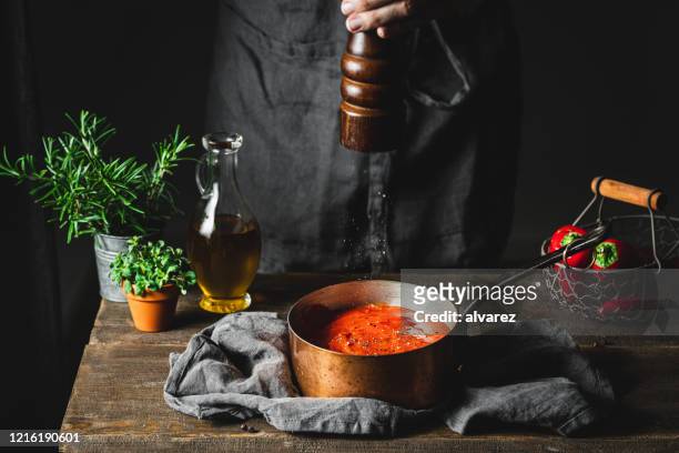 chef preparing red pepper soup - pepper mill stock pictures, royalty-free photos & images