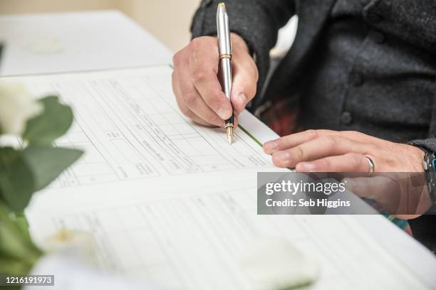 Signing In Register Signing Register Of Marriage Photos and Premium High Res Pictures ...