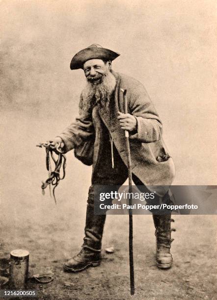 Happy snake hunter in the New Forest, England, circa 1908.