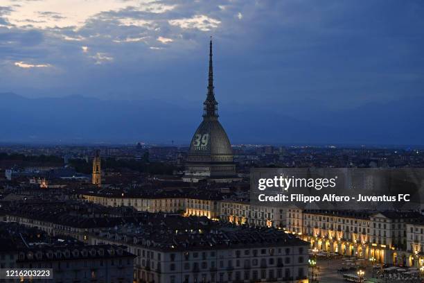 General view of the Mole Antonelliana illuminated in honour of the victims of the Heysel Stadium disaster on May 29, 2020 in Turin, Italy. On May 29...