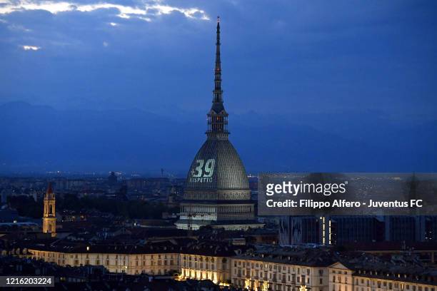 General view of the Mole Antonelliana illuminated in honour of the victims of the Heysel Stadium disaster on May 29, 2020 in Turin, Italy. On May 29...