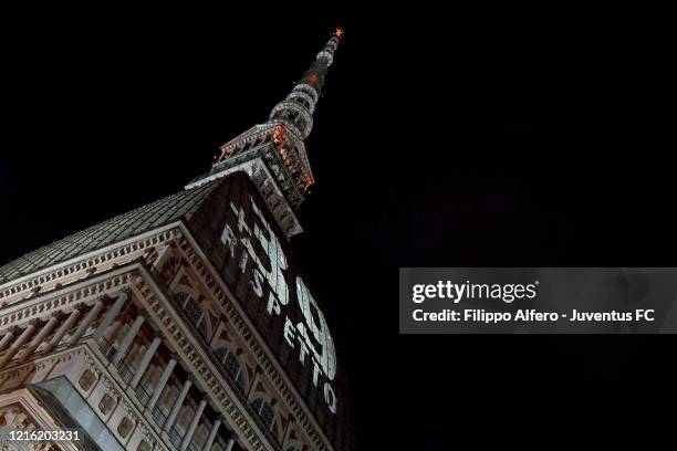 General view of the Mole Antonelliana illuminated in honour of the victims of the Heysel Stadium disaster on May 29, 2020 in Turin, Italy. On May 29...