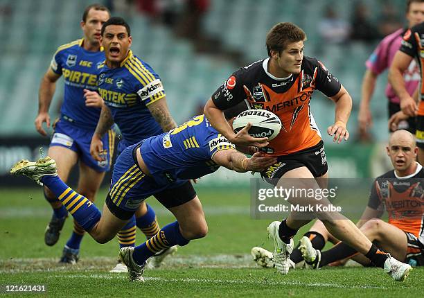 Blake Ayshford of the Tigers makes a break during the round 24 NRL match between the Wests Tigers and the Parramatta Eels at Sydney Football Stadium...