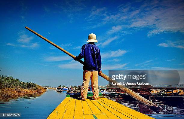 barges over tonle sap lake - tonle sap stock pictures, royalty-free photos & images