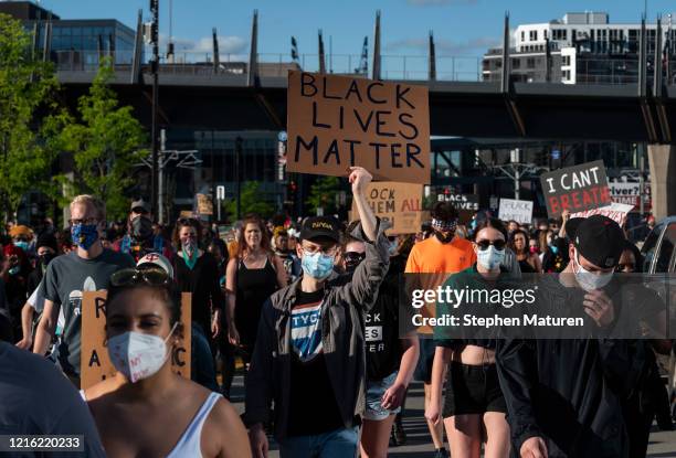 Protesters march by U.S. Bank Stadium in response to the police killing of George Floyd on May 29, 2020 in Minneapolis, Minnesota. Demonstrations and...