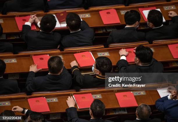 Communist Party delegates attend the closing session of the National People's Congress, which included a vote on a new draft security bill for Hong...