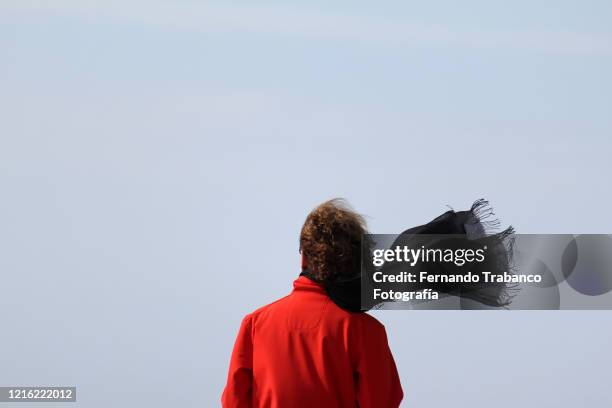 woman in windy day - foulard foto e immagini stock