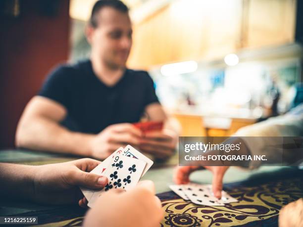 covid-19, family socializing during lockdown - poker stock pictures, royalty-free photos & images