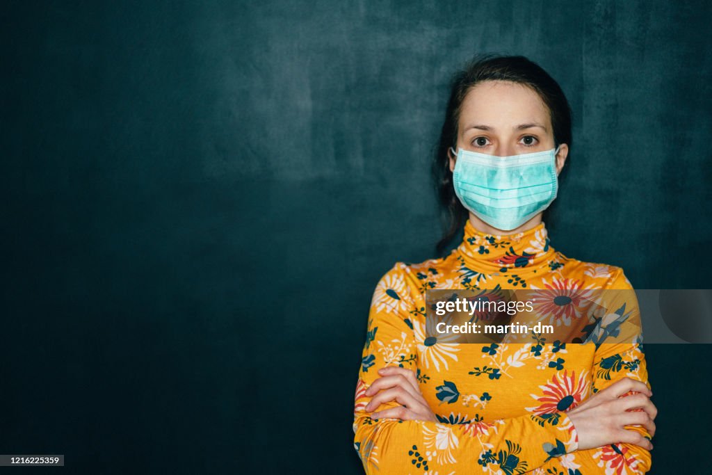 Woman wearing protective face mask during COVID-19 pandemic