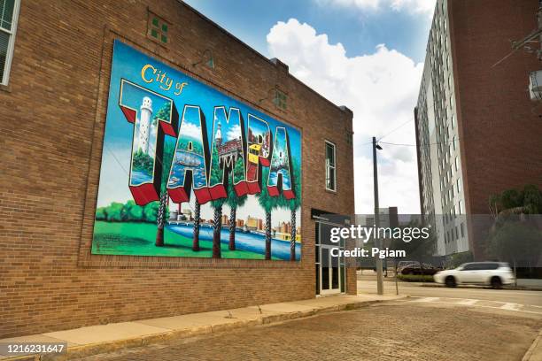 city of tampa florida postcard welcome sign on a downtown wall - tampa day stock pictures, royalty-free photos & images