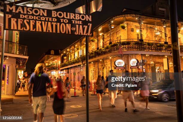 french quarter bars and restaurants on bourbon street new orleans louisiana - new orleans music stock pictures, royalty-free photos & images
