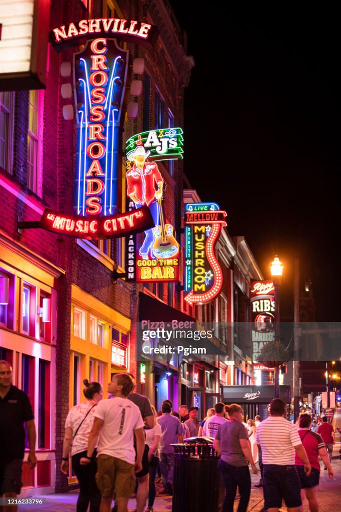 Neon signs along the Broadway in downtown Nashville Tennessee USA