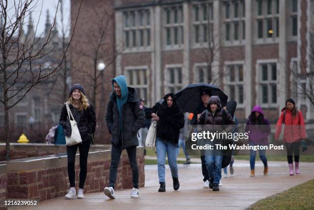 Students walk through campus at Washington University in St. Louis, MO on Wednesday, February 12, 2020. This semester, Chancellor Andrew Martin is...