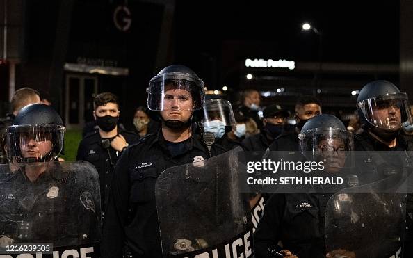 Police Injustice Riot US riot police officers watch as people protest in the city of... News ...