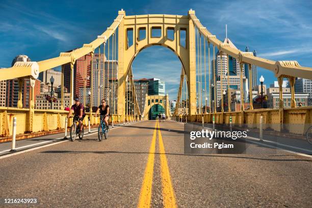 downtown skyline and the roberto clemente bridge in pittsburgh pennsylvania usa - pittsburgh stock pictures, royalty-free photos & images