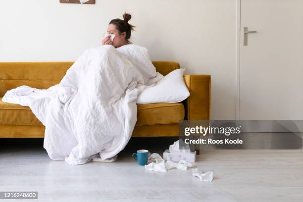 feeling sick - wrapped in a blanket stock pictures, royalty-free photos & images