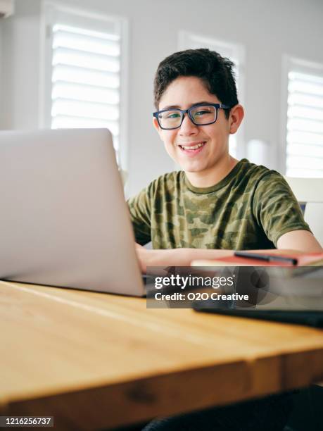 students learning via computer at home - junior high student stock pictures, royalty-free photos & images