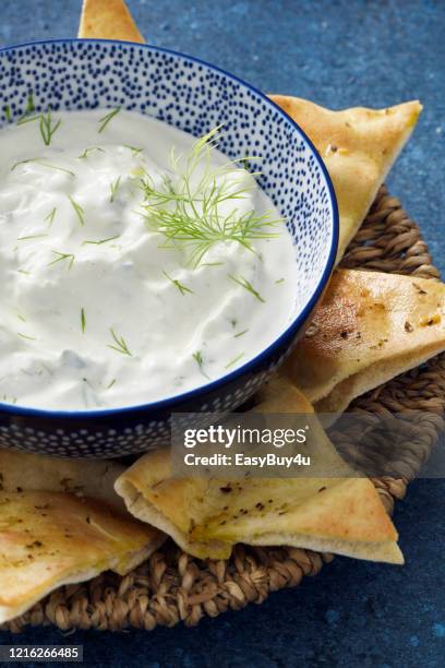 tzatziki dip and pita bread chips - pita bread triangle stock pictures, royalty-free photos & images