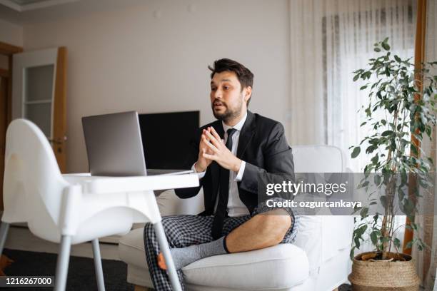 having a productive day - suit pajamas stock pictures, royalty-free photos & images