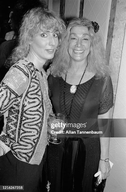 Portrait of American photographer Barbra Walz and actress Sylvia Miles during a Basile Fashions show at Bergdorf Goodman, New York, New York, March...