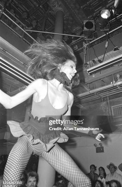 View of an unidentified model on the catwalk during a show of Betsey Johnson's fashions, New York, New York, November 5, 1980.