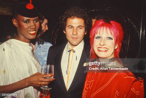 Portrait of, from left, Jamaican model, musician, and actress Grace Jones, American columnist and publicist R Couri Hay , and British fashion...