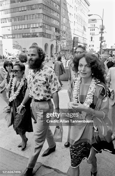 View of Belgian fashion designer Diane Von Furstenberg as she walks, with unidentified others, along 5th Avenue , New York, New York, September 21,...