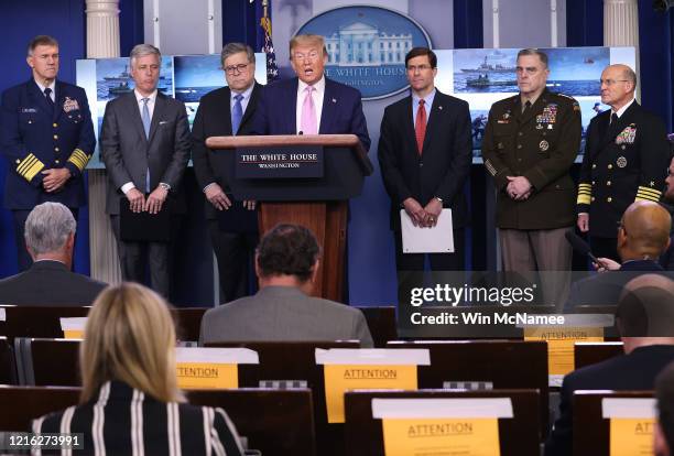 President Donald Trump speaks at the press briefing room flanked Attorney General William Barr , Defense Secretary Mark Esper , Chairman of the Joint...