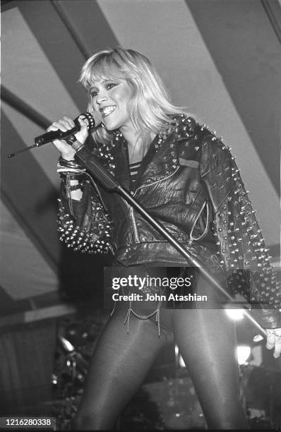 Model and singer Samantha Fox is shown performing on stage during a "live" concert appearance on July 14,1989.