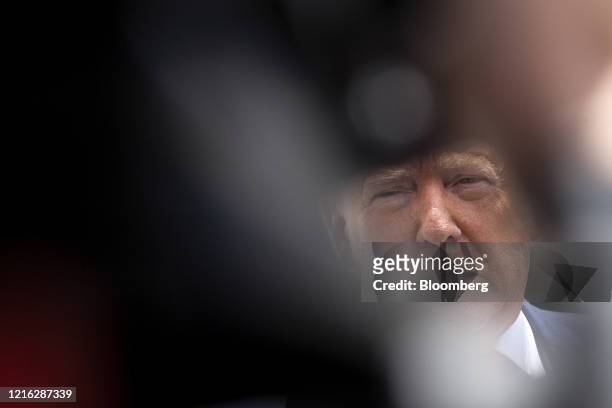 President Donald Trump speaks to members of the media as he departs the White House in Washington, D.C., U.S., on Saturday, May 30, 2020....