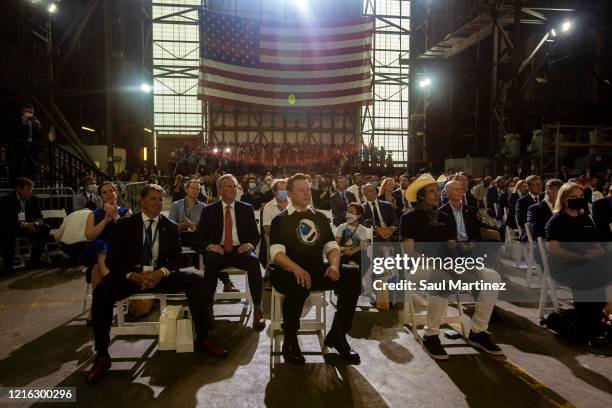 SpaceX founder Elon Musk looks on at an event after the successful launch of the SpaceX Falcon 9 rocket with the manned Crew Dragon spacecraft at the...