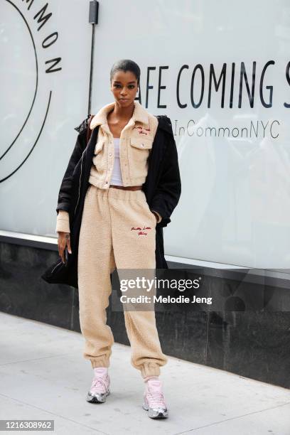 Model Kyla Ramsey wears a Pretty Little Thing shearling jacket and trackpants, pink and silver Raf Simons Adidas Ozweego sneakers after the Longchamp...